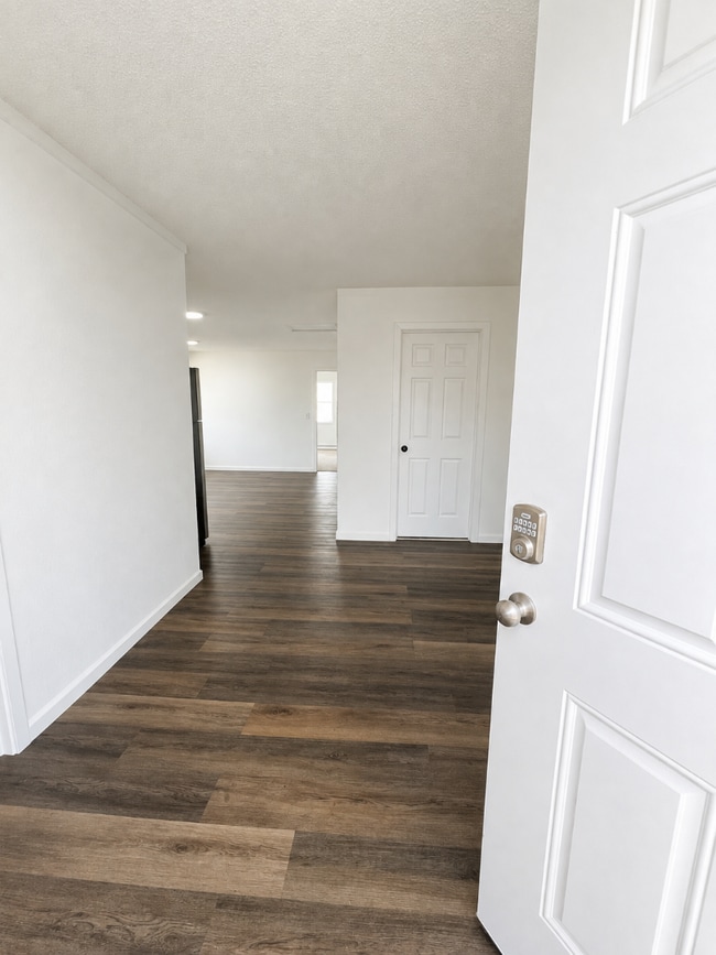 Photo - Elevated 3-Bedroom Home with Secure Garage & Cozy Living Space Unit C