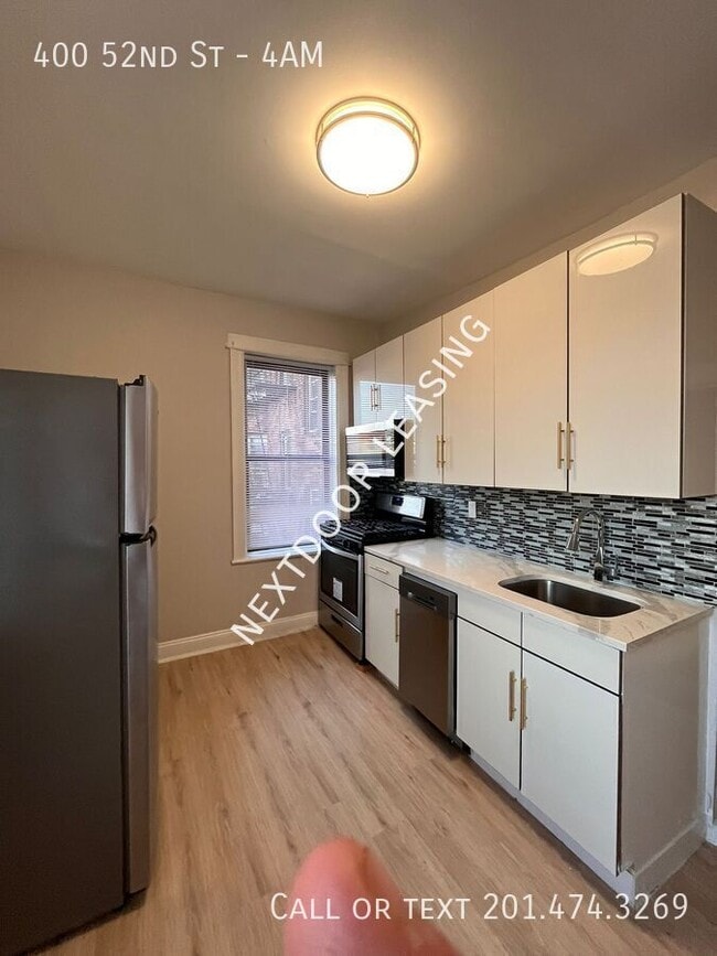 Building Photo - 400 52nd St Unit 4AM