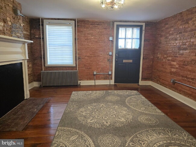 Photo - "Charming 1-Bed Rowhouse with Granite Elegance & Hardwood Warmth in Frederick!"
