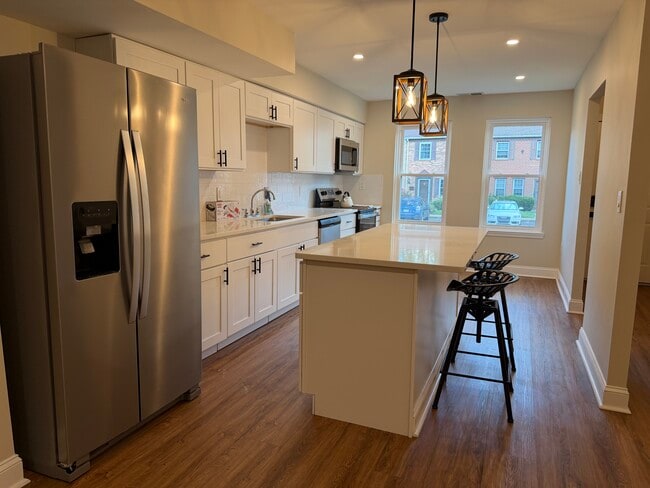 Bright Modern Kitchen • Large center island • Vintage tractor-seat stools • New stainless steel appl - 55 Providence Ave