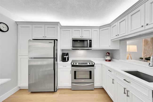 Building Photo - 2660 Carambola Cir N Unit 202 Rental