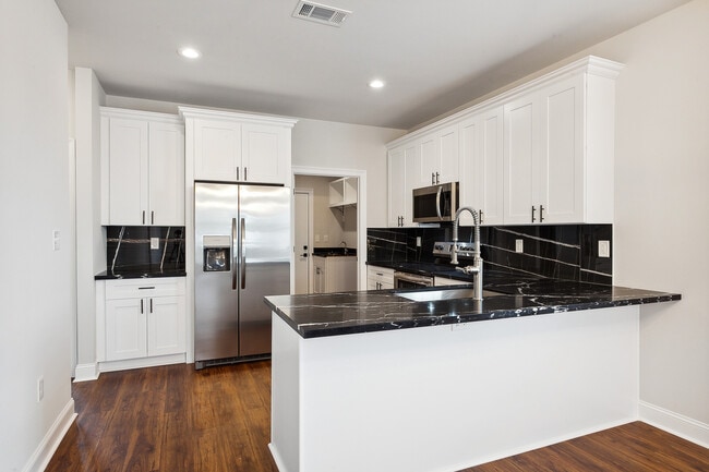 Kitchen and Laundry room in back Appliances included - 1324 Harrison Ave Unit 1324 Harrison Ave