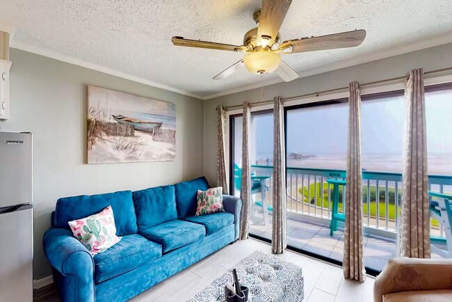 Ocean front living room view w/patio - 6102 Seawall Blvd Condominio Unidad 253