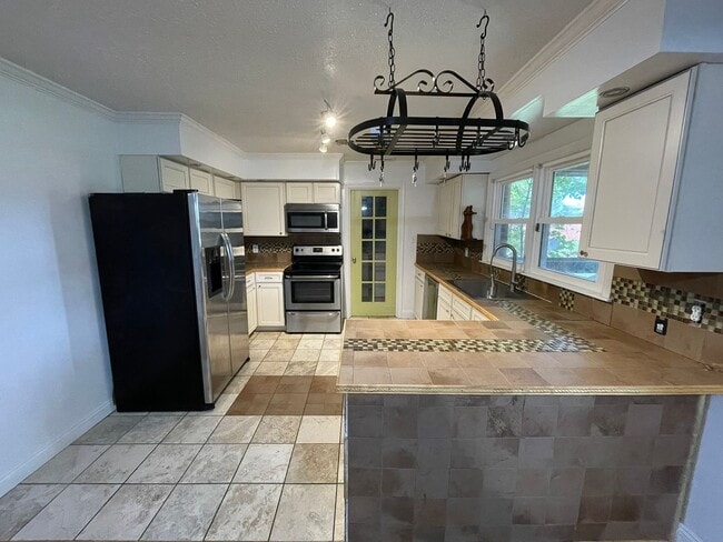 Photo - Spacious Home with Large Yard, Hot Tub, and More