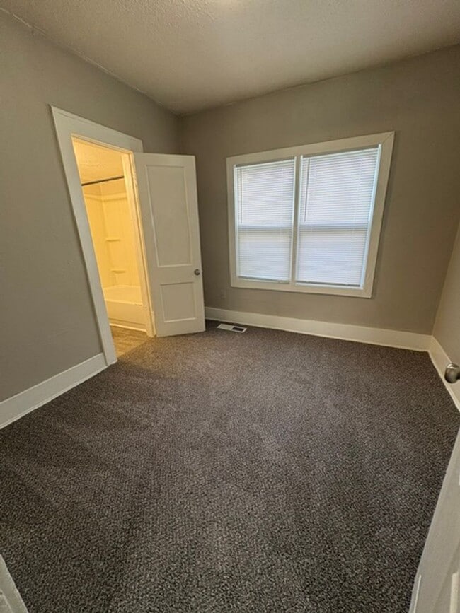 Photo - A cozy 2 bedroom home with versatile living space and plenty of storage including a partially fin...