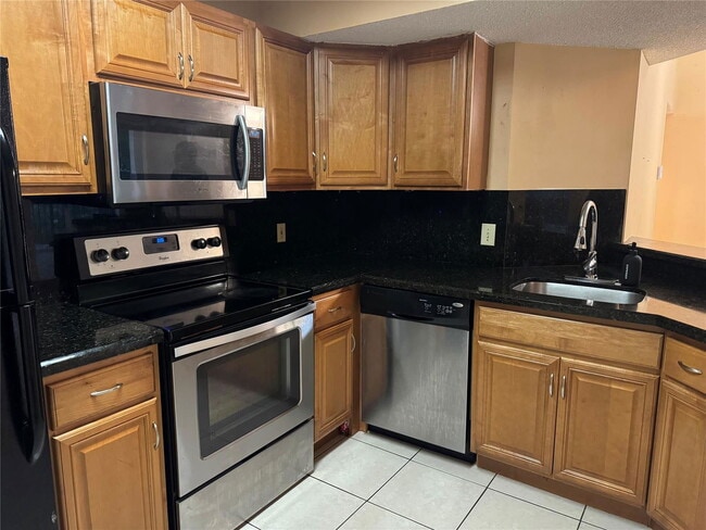 Photo - 9001 Wiles Rd Unit 305