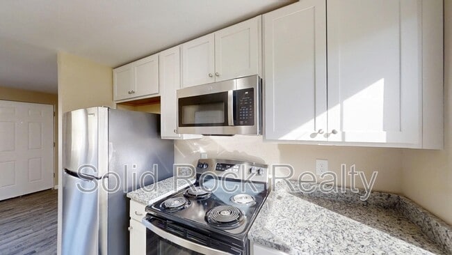 Building Photo - 2405 E St Vrain St Unit 104