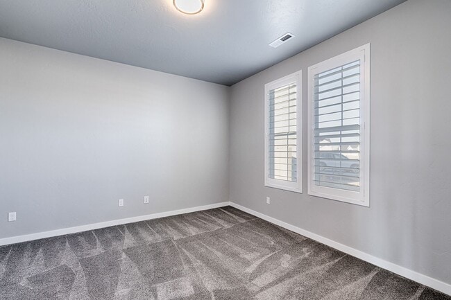 Photo - Custom Hunter-Douglas shutters throughout.
