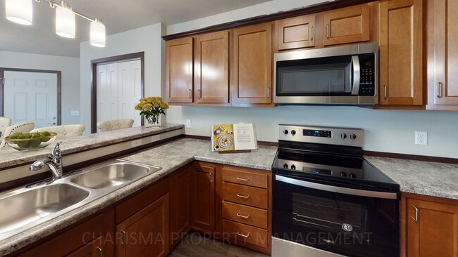 Photo - TOWN HOME WITH INDIVIDUAL ENTRANCE, WALK OUT PATIO, ATTACHED DOUBLE GARAGE & PET FRIENDLY