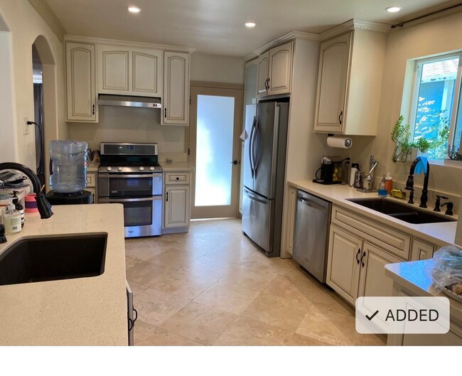 open kitchen with a breakfast counter - 2517 Castle Heights Ave House