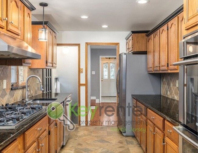 Photo - Spacious 3-Bed, 2-Bath Nutley Home with Bonus Office, Multi-Level Deck & Quiet Location