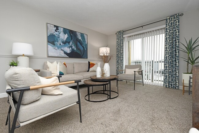 Spacious living room with carpet