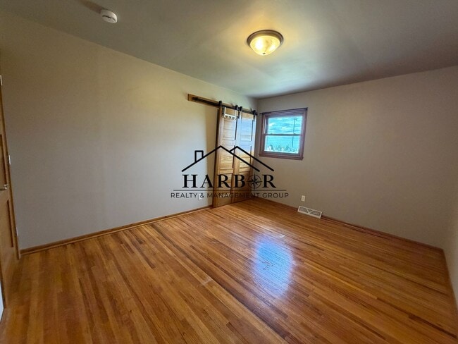 Photo - *1/2 Off First Months Rent* Spacious 3BR Home with 2-Stall Garage & Private Deck in Kasson