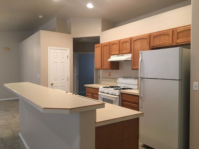Photo - 3-Bedroom Single Family Home with Central Cooling, Attached Garage, and Tile Flooring