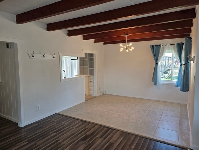Close up of dining room, with view into kitchen. We love these “windows” from the kitchen.