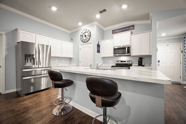 Photo - Spacious 4-Bedroom Home with Fenced Yard & Community Amenities