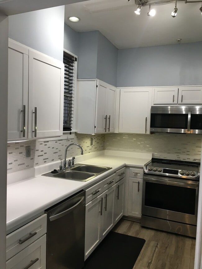 Photo - Midtown 2 story condo. Over 1200 sq ft of living space! Fenced in back yard! Pets are owner's app...