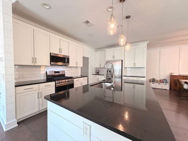 Photo - Available July 1st. Beautiful 4 BR/2.5 BA Home in Highly Desirable Park West! Landscaping included!