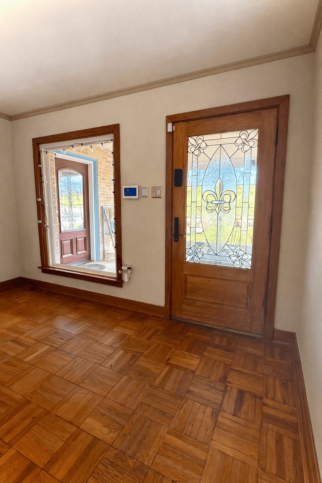 2 lead glass Fleur de Lis exterior doors - 3311 River Rd