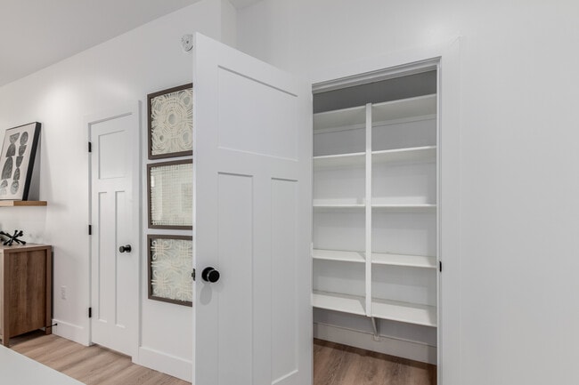 Pantry off Kitchen and 1/2 bath to the left - The CJ Luxury Townhomes