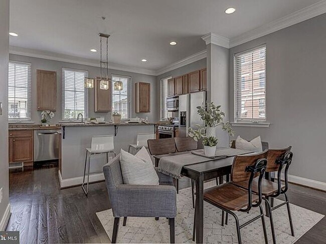 Photo - Beautiful EOG 3 bedroom  2.5 bath townhome with a 2 car garage and roof top deck overlooking the ...