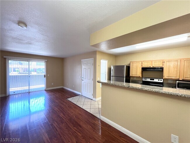Building Photo - 5055 W Hacienda Ave Unit 1200