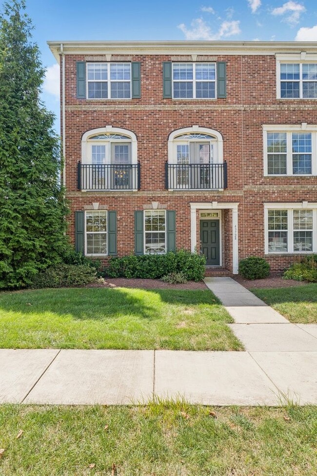 Photo - This beautifully maintained end-unit brick...
