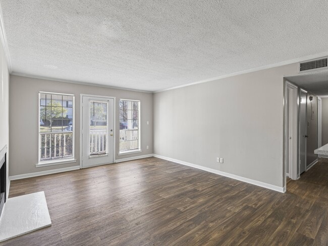 Bright living spaces feature sliding glass doors for easy access to outdoor areas, professionally operated by Highlands Vista Group.