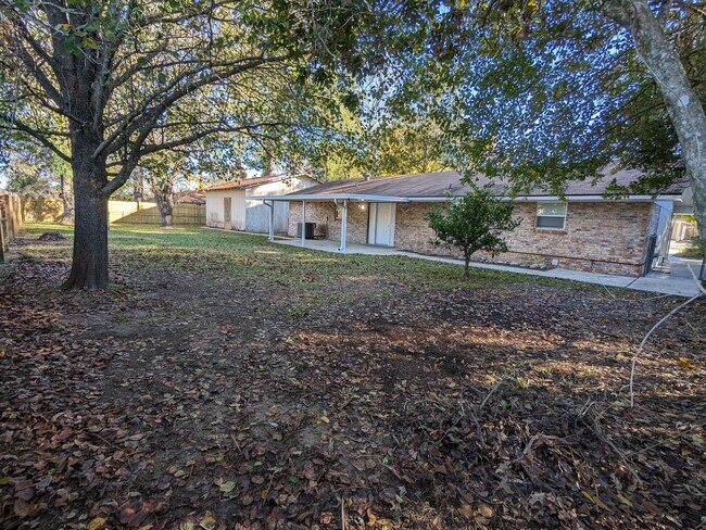 Back yard showing extra half lot space - 121 Joan St