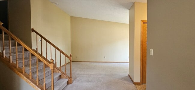 Living room with vaulted ceilings. - 3060 25th St NW
