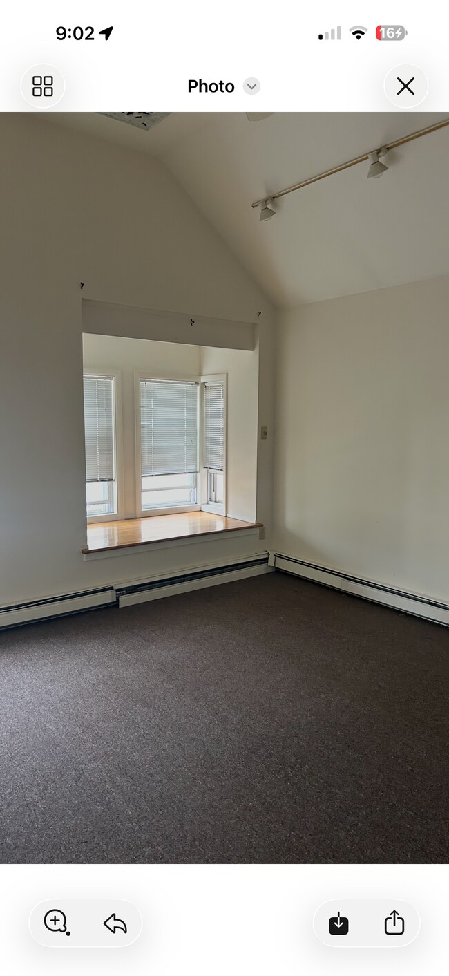 Living room -vaulted ceiling, large window seat - 147 Barrett St Unit 1