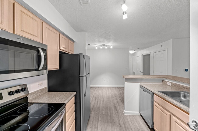 Kitchen Area With Wooden Flooring - The Preserve at Walpole Apartments