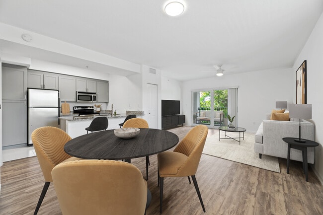 Renovated Package I dining and living room with hard-surface vinyl plank flooring