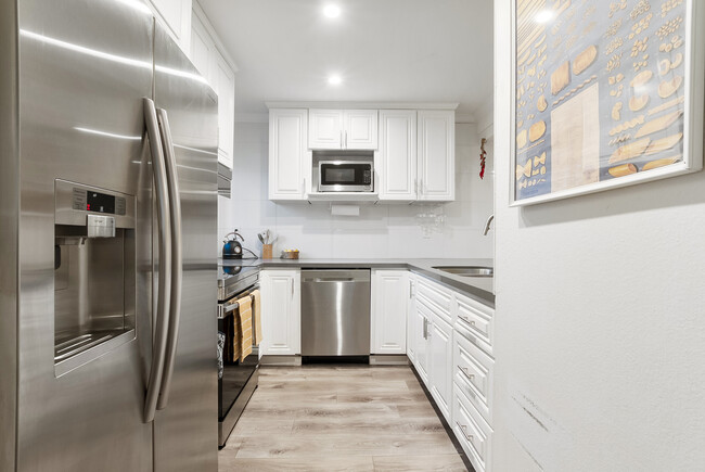 Unleash your inner chef in our fully equipped luxury kitchen, where culinary dreams come to life. - 4110 Mount Alifan Pl Condo Unit 4110 Mt Alifan Dr 92111