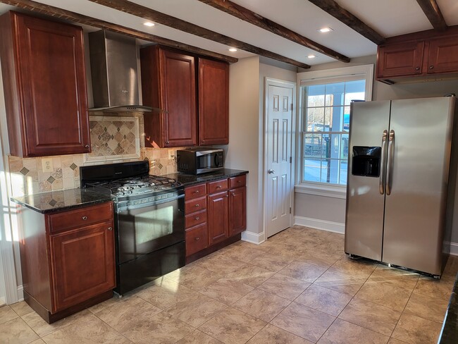 Stove and Fridge window facing Erie St - 731 N Stokes St Unit Apt. A