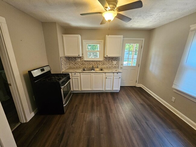 Photo - Spacious 4-Bedroom Cleveland Home with Updated Flooring & 2-Car Garage