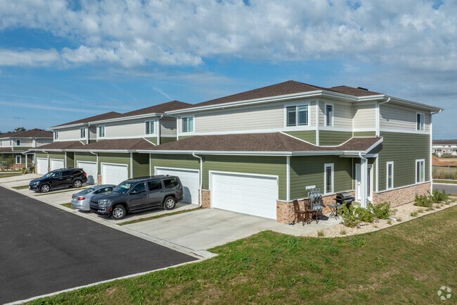 Each Townhome as an attached garage! - The Townhomes at Hartung Fields