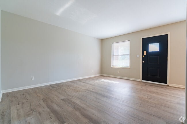 1BR, 1BA - 700SF - Living Room - The Rockford Arms Apartment Community