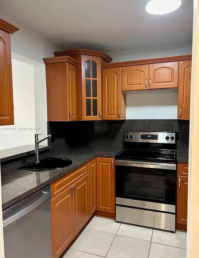 Building Photo - 8720 N Sherman Cir Unit 307