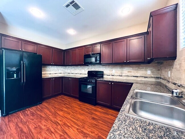 Photo - Gorgeous two story 4 bedroom family home! Upstairs there is a spacious loft and downstairs there ...