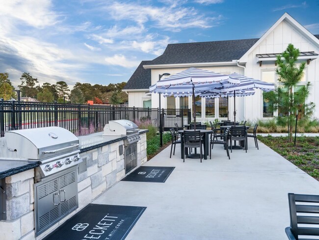 Our outdoor kitchen and grilling areas are perfect for cookouts, gatherings, or a laid-back evening under the stars. - Beckett West Fork Apartments
