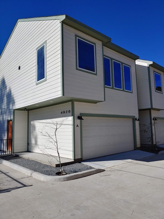Front view from street. Pictured Unit A. The subject property (Unit D) is fourth from the street. - 4926 Weeping Willow Rd Unit E