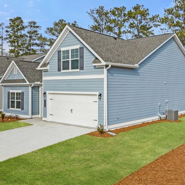 Exterior of the Wakefield, two story home with a private driveway and attached garage.