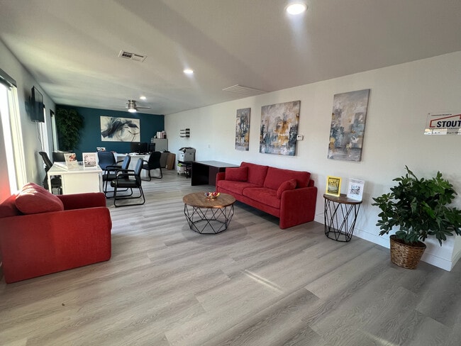 Experience the perfect blend of comfort and functionality in this beautifully designed living and office area. - Madison Green Valley