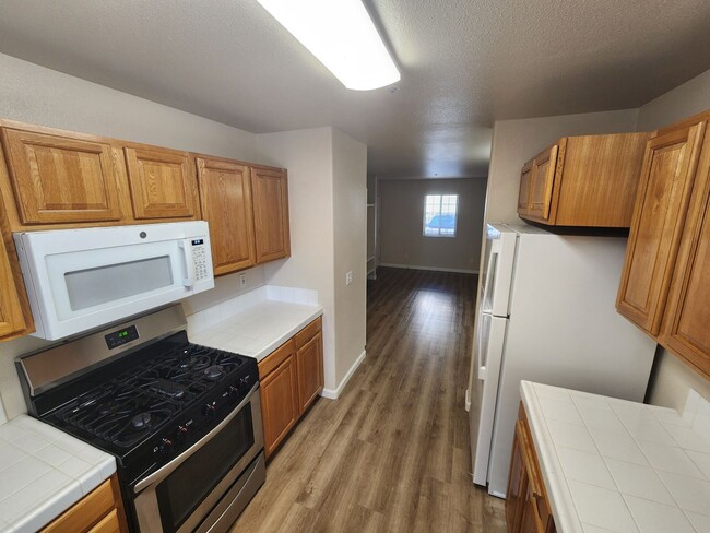 Building Photo - Downstairs 1 bedroom apartment with small patio and additional storage Unit 3372 #1
