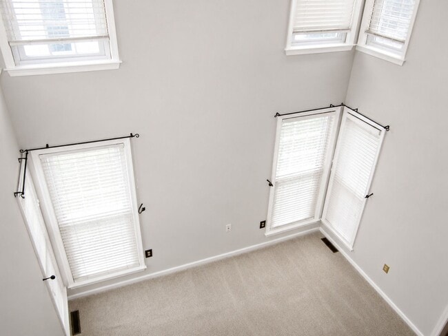 Photo - Spacious End-Unit Townhome Available August 1 | Finished Basement, Fenced Yard & 2-Car Garage