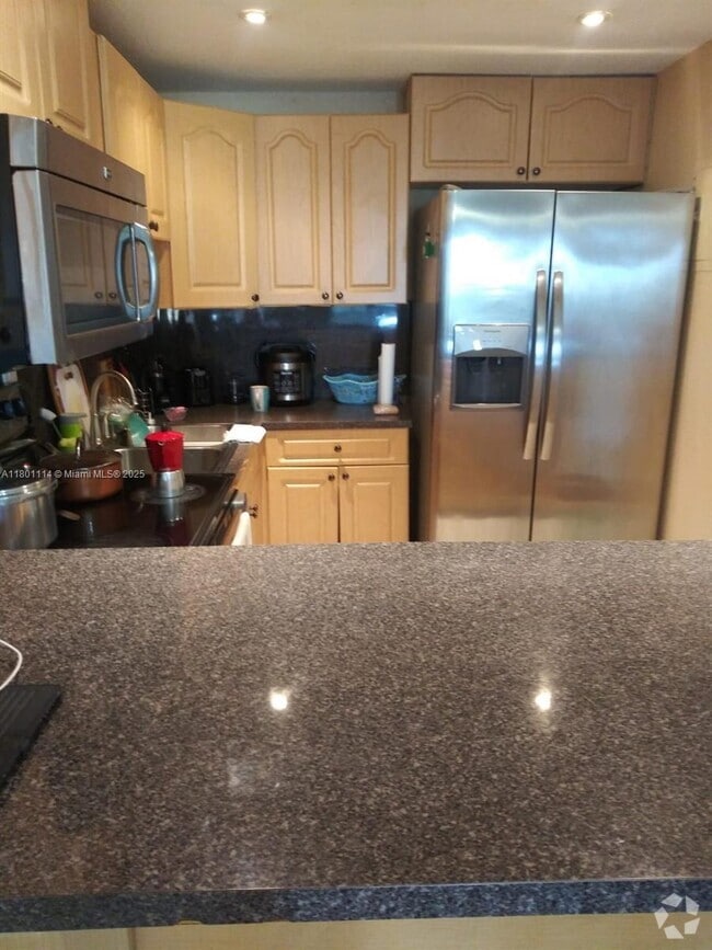 Building Photo - 6095 W 19th Ave Unit 407 Rental