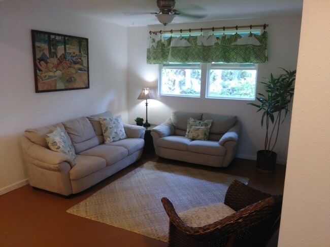 Ground level bedroom staged as living room - 329 Auwinala Rd