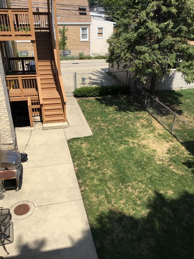 fenced in yard - 5207 N Latrobe Ave Apartments Unit 1