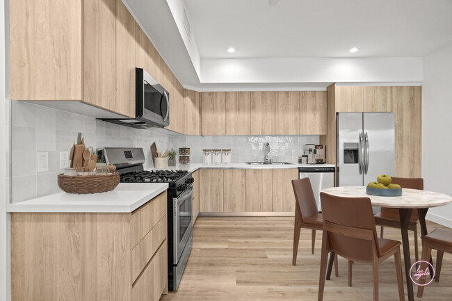 Kitchen with Stainless-Steel Appliances - Bardot Floor Plan - Tamarind Fountain Apartments